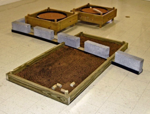 Earthscape/Down on the Farm
Wood, Vinyl, Concrete Block, Nails, 
Roofing Paper, Top Soil, Sand
10’ 8” L. x 8’ 6” W. x 1’ H.
2007